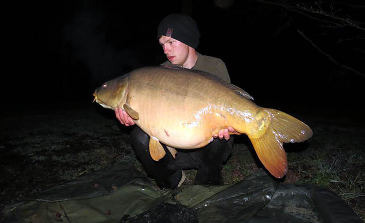 Consultant ecologist and keen angler, Joseph, holding a 47lb carp which was placed back in the water-body © Joseph Baker 