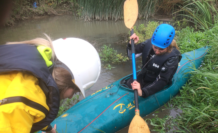 Ecologists Emma (canoe) and Heather (left) on a water vole survey by canoe © Thomson Environmental Consultants