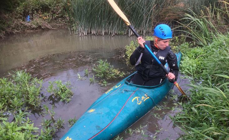 An ecologist canoeing during a water vole survey © Thomson Environmental Consultants
