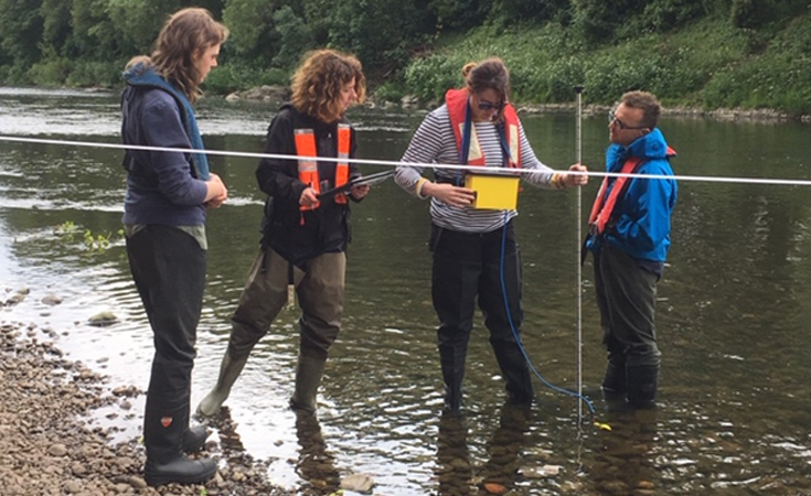 Thomson freshwater team spot flow gauging on the River Taff in June © Tansy Knight